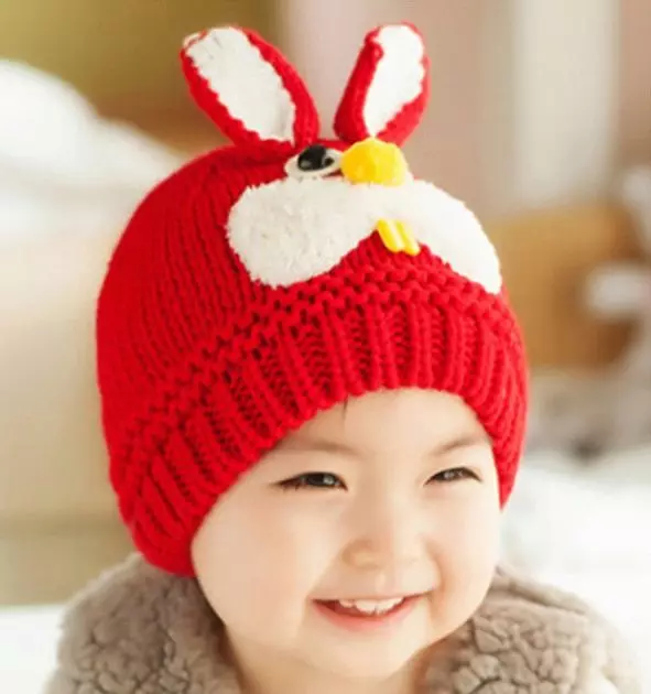 Mũ dệt kim cho bé gái (91 ảnh): Đối với thanh thiếu niên 12-14 tuổi và cô gái sơ sinh với đôi tai, mũ ấm áp-uphanka 13615_15