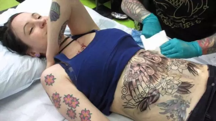 Tattoo vatsaan tyttöjen (61 valokuvaa): luonnokset. Tatuoinnit vatsan alareunassa ja navan ympärillä synnytyksen jälkeen, pieni kaunis tatuointi ja iso 13772_57