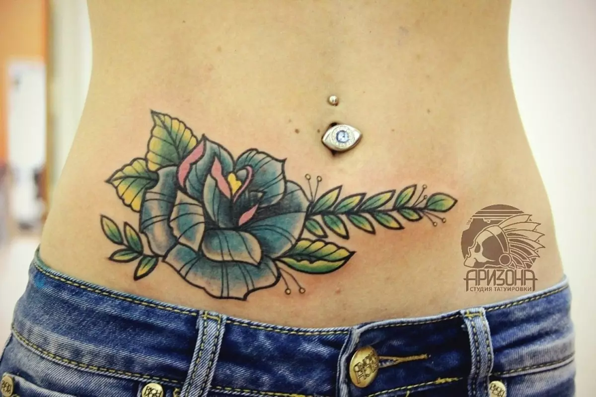Tattoo on the stomach (50 photos): on the navel, on the press and the abdomen at the bottom. Sketches of beautiful tattoos. Tattoo figures 1999 and 2002, 1998 and others, other options for small and large images 13790_40