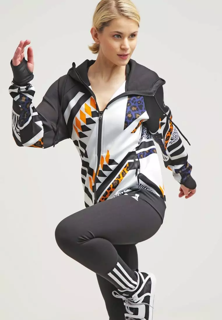 Adidas Sports Suits (100 wêne): Suitê Sporê jin û Zarokan, sêwirana Adidas Porsche, performans û medreseya rastîn 1388_10