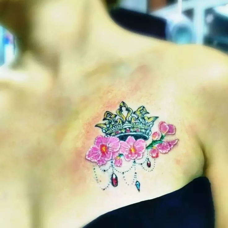 Tattoo z orhidejami (57 fotografij): tattoo vrednost za dekleta, skica pregled. Tattoo na roki in nogi, na ključnico in na hrbtu, na rami in na drugih delih telesa 14034_19
