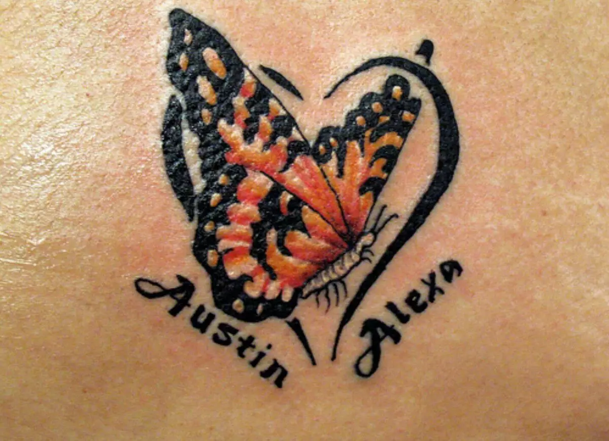Tatuering med namn (57 bilder): Tatueringar på handen på handleden och på fingret, skisser av den nominella tatueringen för tjejer och för män. Härlig tatuering och andra alternativ 14047_26