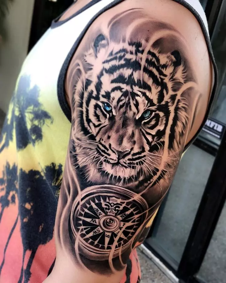Tattoo met tijgers (44 foto's): schetsen en de waarde van tatoeages, tatoeage op de schouder en bij de hand, op de borst en op de achterkant, op de voet en op de borstel, op de onderarm en in andere zones 14168_11