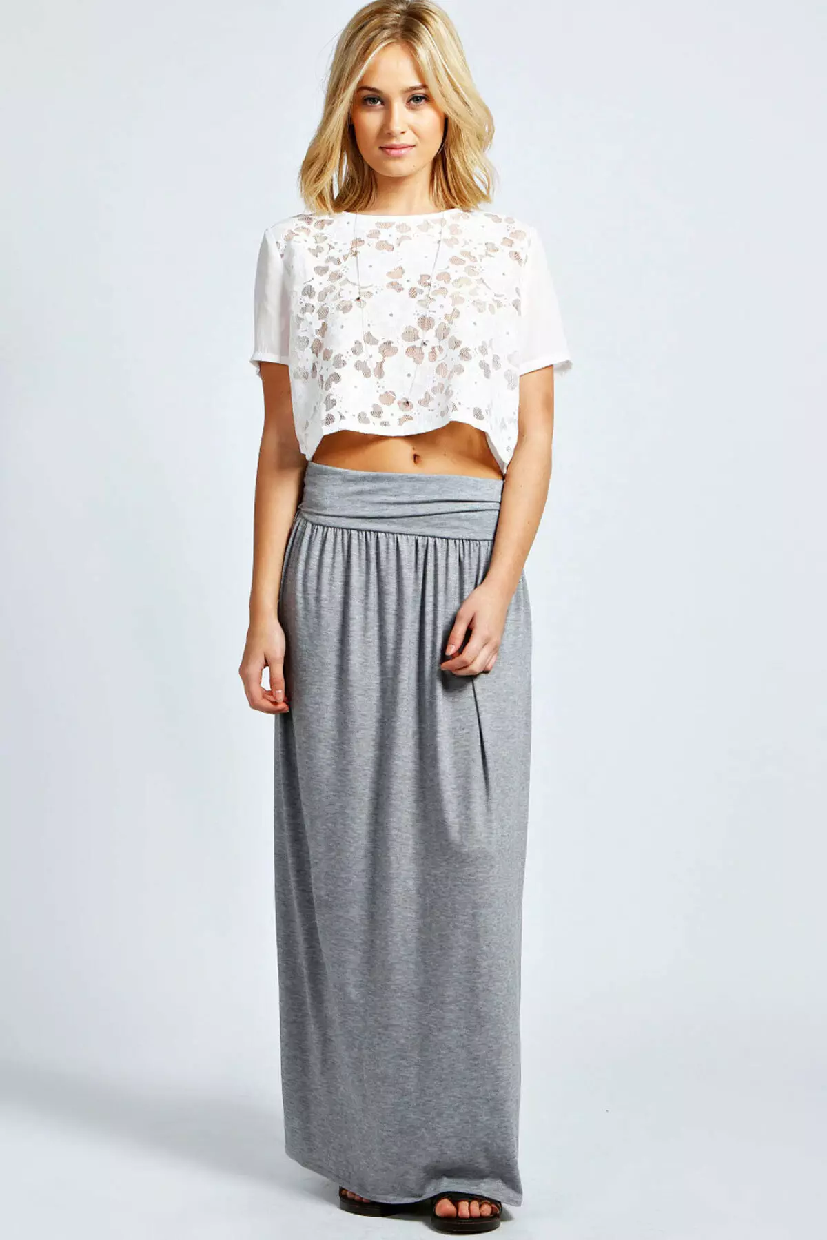 Stickade kjolar (80 bilder): What to wear, penna, långa och korta, på elastisk, grått, svart, vit 14613_27