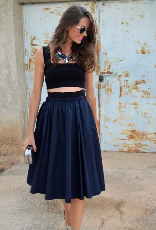 Lush skirt below the knee with a short tight top