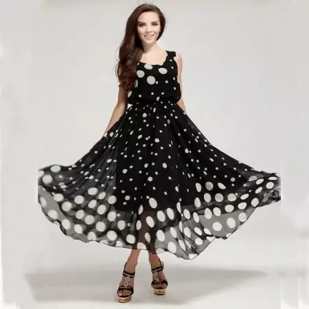 Black and white polka dot dress of different sizes