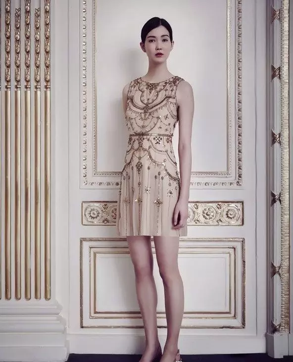 SHORT EVENING DRESS WITH EMBROIDERY.