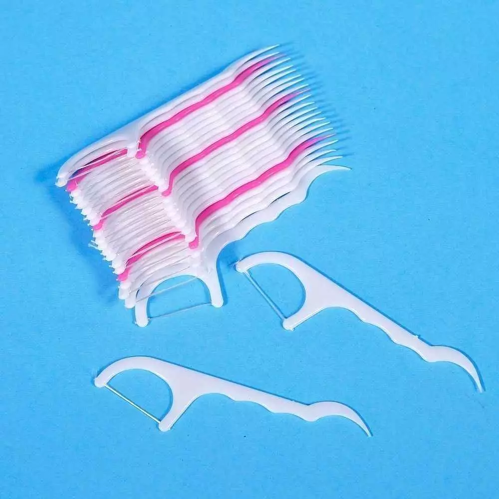 Zahnstochern mit Gewinde: wie eine Zahnseide für die Zähne wählen? Wie ein Zahngewinde auf einem Plastikstab benutzen? 16188_18