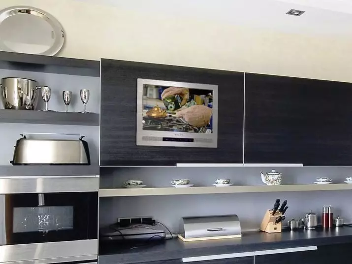 Opcions d'allotjament de la televisió de cuina (56 fotos): instal·lació en els auriculars de la cuina, opcions de disseny de cuina. Com penjar la televisió sobre la taula? 20943_14