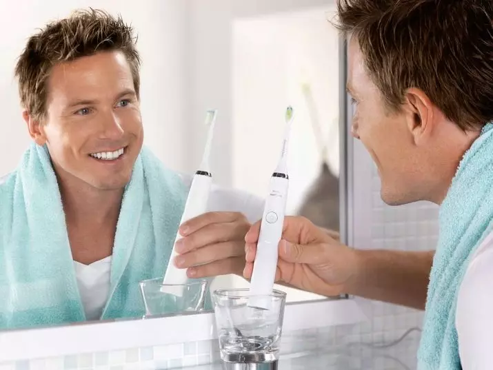 Sound tandenborstels: is de elektrische borstels voor tanden beter? Beoordeling, plussen en nadelen. Wat is het en wat te kiezen? Hoe maak je je tanden schoon? 24010_16