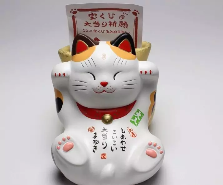 Maleki-Neco: Kassi väärtus on õnne, Jaapani kassi statuetid tõstetud paremale ja vasakule käpale. Miks on kitty oma käpa heita? Kust panna joonis? 24827_12