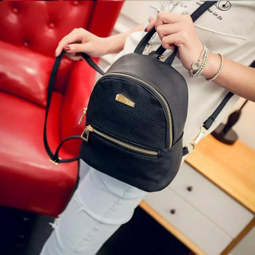 Mochilas de couro (97 fotos): mulheres de couro genuíno e eco-árvore, pequenas e grandes modelos de marca, urbanas e negócios, moda elegante e elegante 2563_64