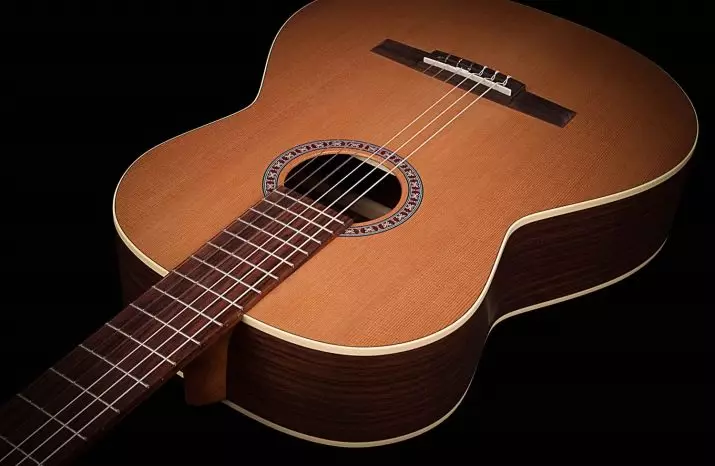 Klipp gitarr: akustisk, klassisk 12-sträng och annan modell. Varför behöver du Cutaway (Catway)? Vad är den bättre gitarr utan cutout? 26251_5