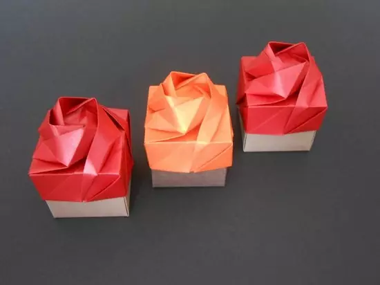 Origami gutusy: gapagy bilen öz eliňiz bilen kagyz gutusy nädip ýasamaly? Shemada guty pişigini nädip bukmaly? Ýelimsiz görkezme boýunça basgançakly görkezmelerde iň ýönekeý 