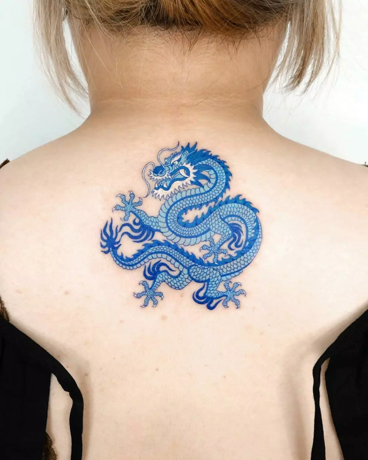 Tattoo with dragons (68 photos): sketches and values. Tattoos on hand and on the shoulder, on the back and on the hip, on the neck and leg, on the forearm and on other parts of the body 279_15
