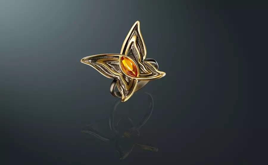 Cincin dengan Amber (60 foto): Dalam perak dan emas, cincin padat yang indah dari kuning dan beraneka warna, dengan carnelian 3146_60