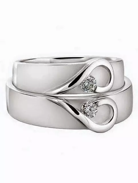 Bijeli zlatni prstenovi (101 fotografije): široki prstenovi i minđuše sa safirom, smaragdom i topazom 3160_14