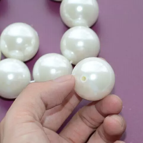 ¿Cómo distinguir las perlas naturales de artificial? 37 Foto ¿Cómo determinar qué es real? ¿Cómo comprobar la autenticidad en casa? ¿Qué aspecto tiene el falso? 3255_26