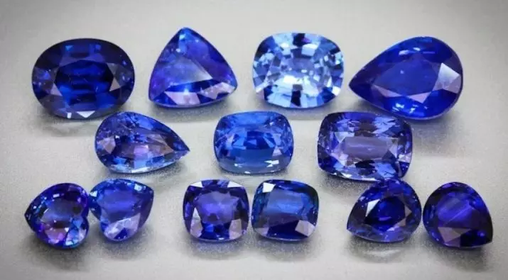 Sapphires rangi (picha 21): pink na kijani, machungwa na samafi ya rangi ya zambarau, aina ya giza na mkali, rangi isiyo na rangi na kubadilisha rangi 3436_6