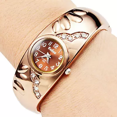 Goldene Uhr mit einem goldenen Armband (77 Fotos): Frauengoldmuster 3559_26