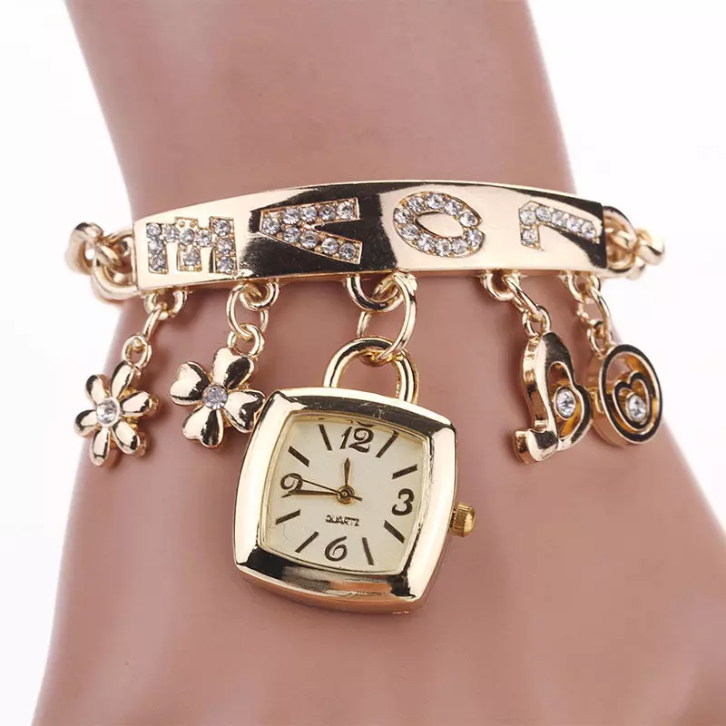 Gouden klok met een gouden armband (77 foto's): Gouden patronen voor dames 3559_42