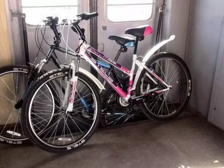 Hvordan transporterer en sykkel i toget? Hvordan kan du transportere den på toget på lang avstand? Rubler gni regler. Hvordan pakke? 8565_2