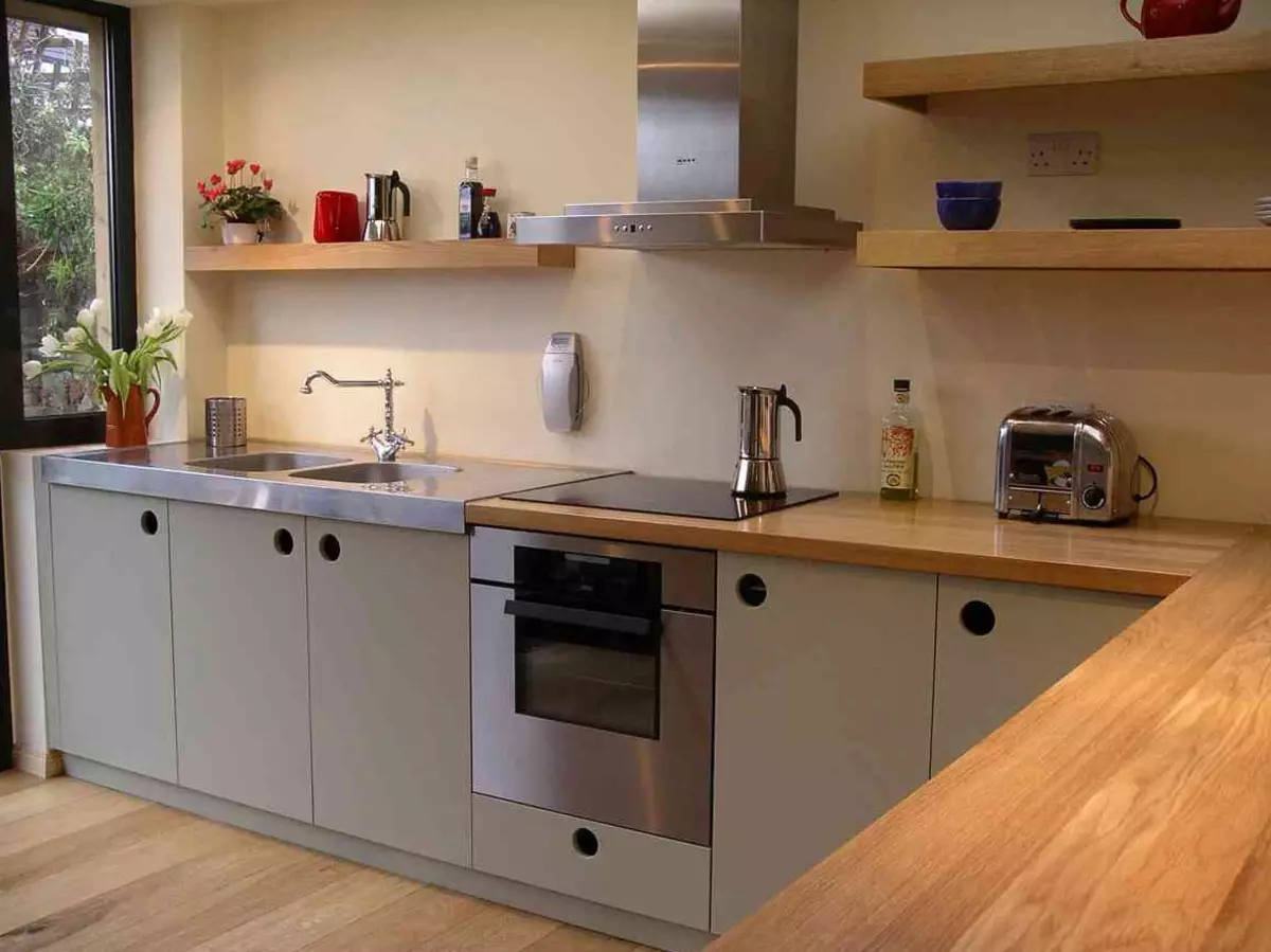 Bucătării încorporate (70 fotografii): Dimensiuni de capete și design de bucătărie. Ce este și ceea ce este diferit de bucătăria modulară? Opțiuni de proiect în apartament obișnuit 9546_9