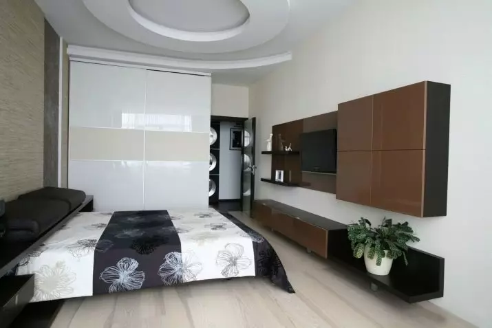 बेडरूम डिजाइन 19-20 केवी। एम (72 फोटो): एक ड्रेसिंग रूम और बालकनी 5 से 4 मीटर के साथ कमरे का इंटीरियर, एक आधुनिक शैली में आयताकार और अन्य बेडरूम का लेआउट 9897_69