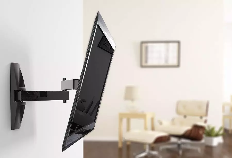 Alternativ för placering av TV: n i sovrummet (37 bilder): Vad är höjden från golvet för att hänga en TV på väggen? Exempel på installationen av TV- och designalternativen 9933_11