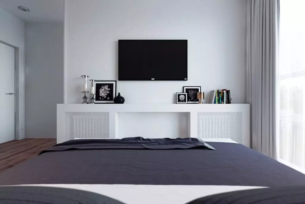 Valgmuligheder for placering af tv'et i soveværelset (37 billeder): Hvad er højden fra gulvet for at hænge et tv på væggen? Eksempler på installationen af ​​tv- og designmulighederne 9933_2